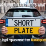 Person holding replacement 'SHORT PLATE' for missing number plate, with text overlay 'MISSING NUMBER PLATE? HERE'S WHAT TO DO' and car without plate in urban setting.